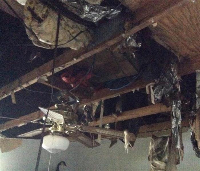 debris, charred, hanging from ceiling from attic