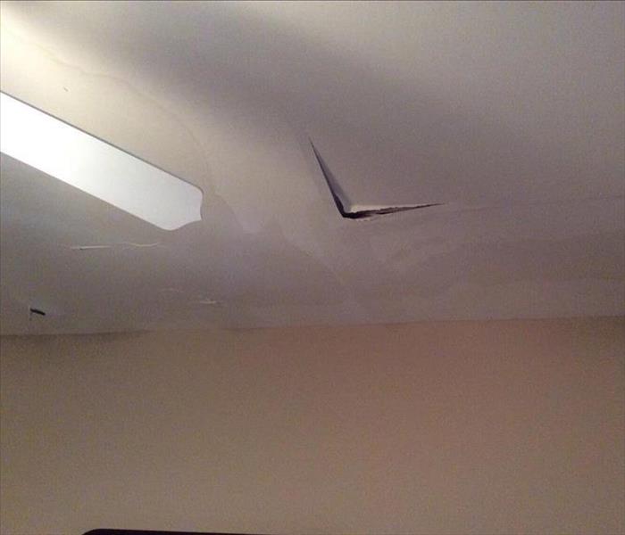 holes and water damage in the ceiling
