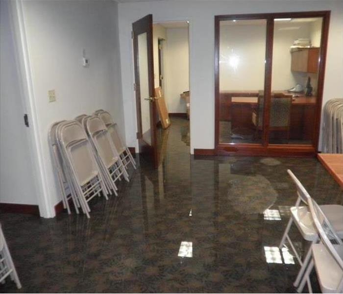 water pooling on carpeted office floor