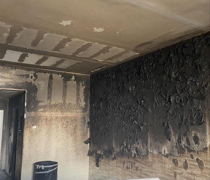 Badly burned interior room needing fire restoration services
